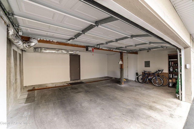377 E Knotty Pine Ln Unit 2, Coeur Dalene, ID 83815 - garage with electric panel and a garage door opener