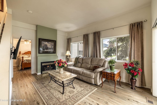 377 E Knotty Pine Ln Unit 2, Coeur Dalene, ID 83815 - living area with light wood-style floors and baseboards