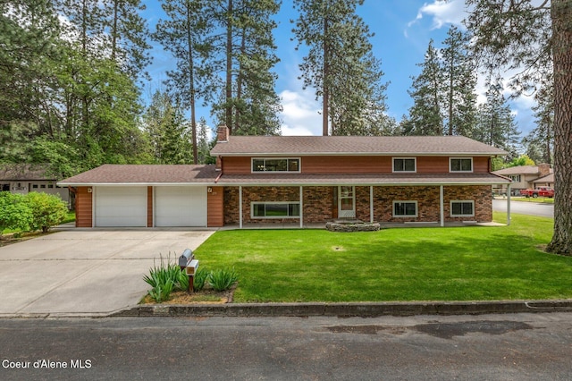 279 S Sequoia Ct, Post Falls, ID 83854 - traditional-style home with an attached garage, a chimney, driveway, and a front lawn