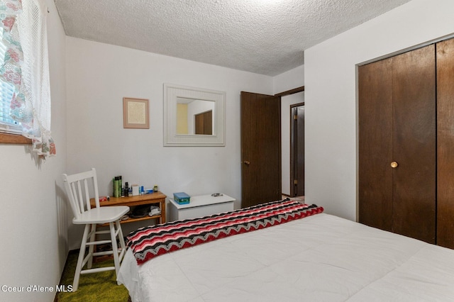279 S Sequoia Ct, Post Falls, ID 83854 - carpeted bedroom with a textured ceiling and a closet