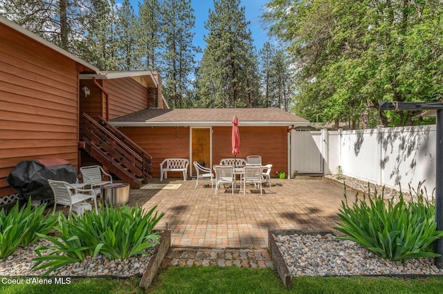279 S Sequoia Ct, Post Falls, ID 83854 - view of patio / terrace with fence, a gate, and outdoor dining space