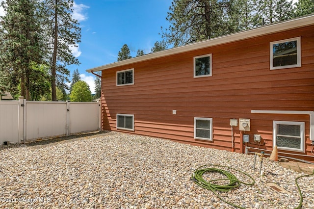 279 S Sequoia Ct, Post Falls, ID 83854 - view of side of home featuring a gate and fence