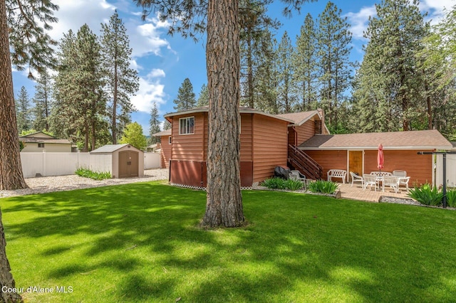 279 S Sequoia Ct, Post Falls, ID 83854 - rear view of house with a shed, a patio area, and an outdoor structure