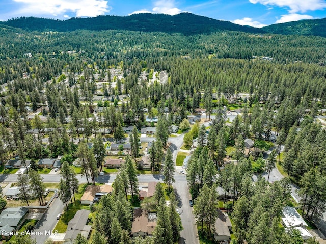 279 S Sequoia Ct, Post Falls, ID 83854 - aerial view of property and surrounding area featuring a forest, a mountainous background, and nearby suburban area