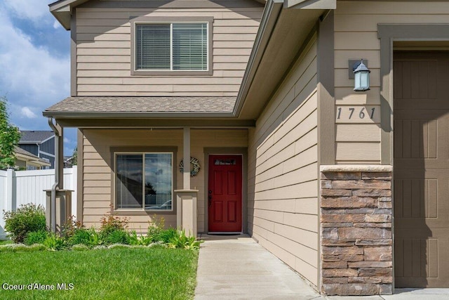 1761 W Pyrenees Loop, Coeur Dalene, ID 83815 - doorway to property with fence and roof with shingles