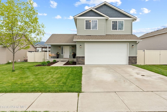 6595 W Covenant St, Rathdrum, ID 83858 - craftsman house featuring stone siding, a garage, a porch, and concrete driveway
