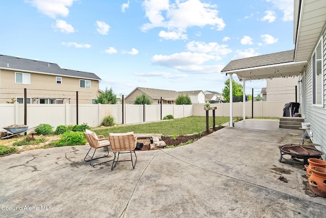 6595 W Covenant St, Rathdrum, ID 83858 - view of patio with a fire pit and a residential view