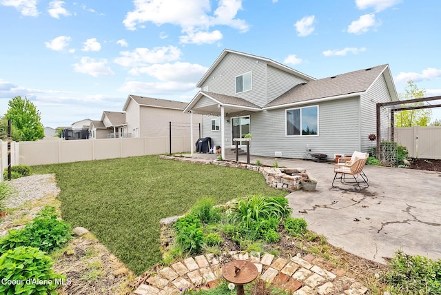 6595 W Covenant St, Rathdrum, ID 83858 - rear view of property featuring a patio and roof with shingles