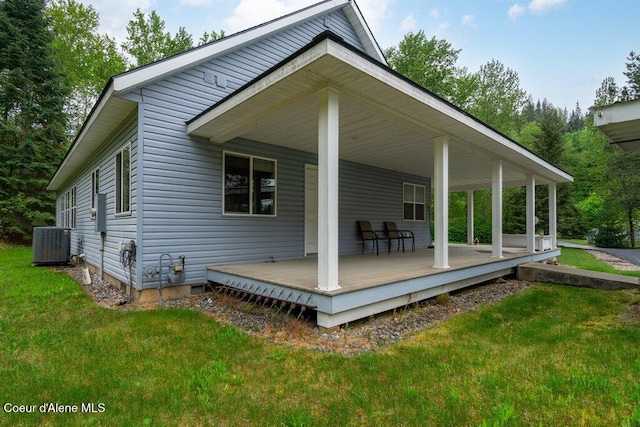 911 French Gulch Rd, Kingston, ID 83839 - rear view of house featuring central AC unit and a yard
