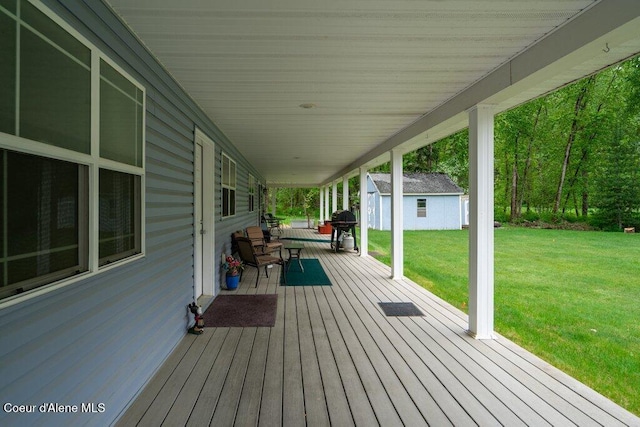 911 French Gulch Rd, Kingston, ID 83839 - deck featuring an outbuilding, a lawn, and area for grilling