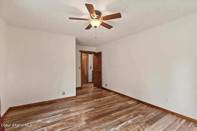 1072 Upland Dr, Sandpoint, ID 83864 - unfurnished room featuring wood finished floors, baseboards, and a ceiling fan