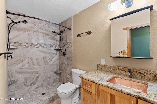 1072 Upland Dr, Sandpoint, ID 83864 - bathroom with toilet, vanity, and a tile shower