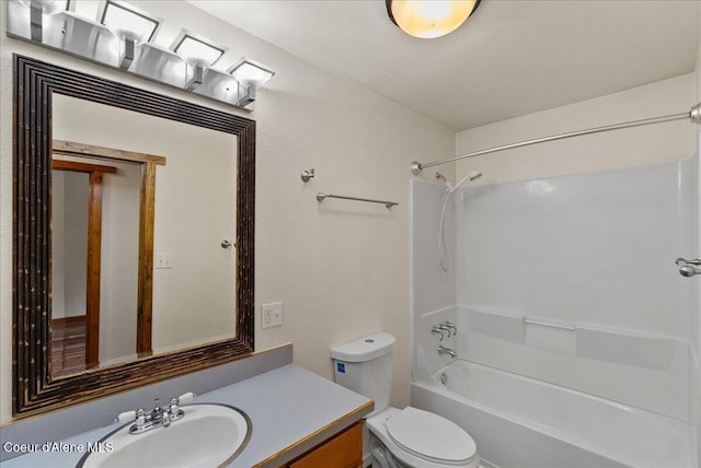 1072 Upland Dr, Sandpoint, ID 83864 - bathroom with toilet, vanity, tub / shower combination, and a textured wall