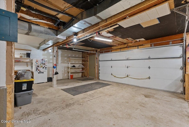 1072 Upland Dr, Sandpoint, ID 83864 - garage featuring freestanding refrigerator