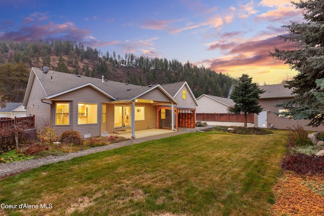 5519 N Wade St, Coeur Dalene, ID 83815 - view of front facade with a patio area and a shingled roof