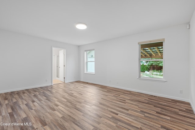 5519 N Wade St, Coeur Dalene, ID 83815 - spare room with wood finished floors and baseboards