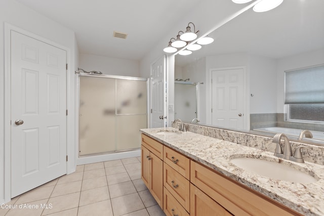 5519 N Wade St, Coeur Dalene, ID 83815 - bathroom with a shower stall, tile patterned floors, double vanity, and a tub to relax in
