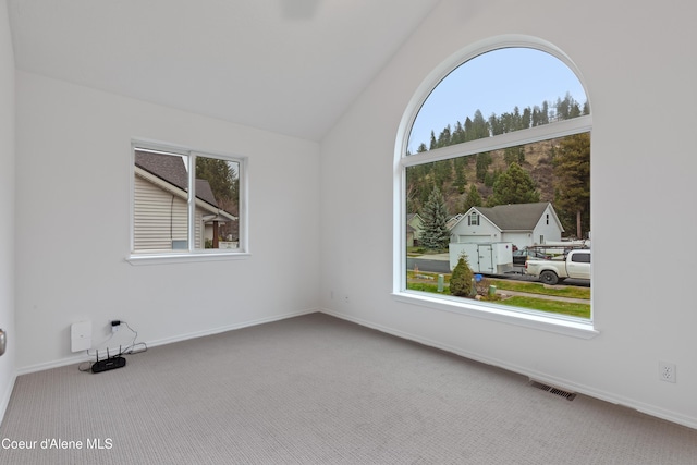 5519 N Wade St, Coeur Dalene, ID 83815 - unfurnished room featuring carpet floors, vaulted ceiling, and baseboards