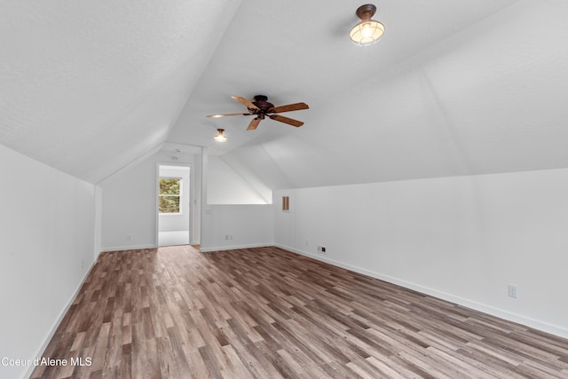 5519 N Wade St, Coeur Dalene, ID 83815 - bonus room featuring wood finished floors, baseboards, vaulted ceiling, and a ceiling fan
