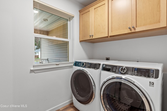 5519 N Wade St, Coeur Dalene, ID 83815 - clothes washing area featuring cabinet space, washer and clothes dryer, baseboards, and wood finished floors