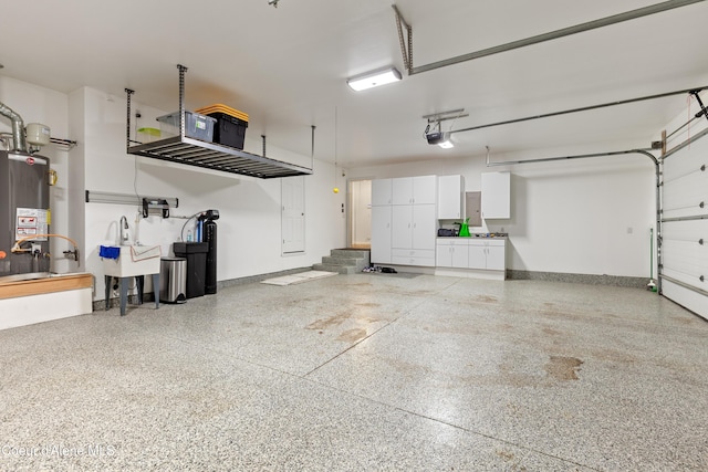5519 N Wade St, Coeur Dalene, ID 83815 - garage featuring water heater, a garage door opener, and baseboards