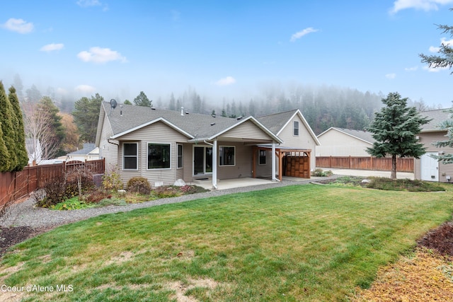 5519 N Wade St, Coeur Dalene, ID 83815 - ranch-style home featuring a patio area and a garage
