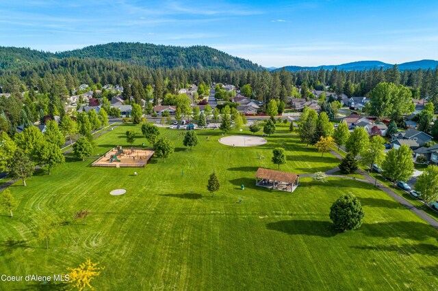 5519 N Wade St, Coeur Dalene, ID 83815 - aerial perspective of suburban area featuring mountains and a forest