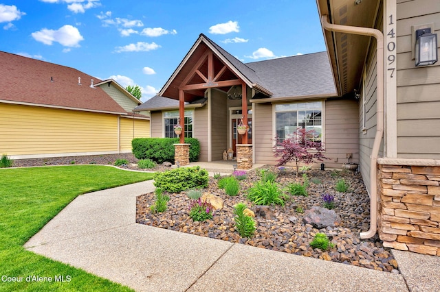 14097 N Pristine Cir, Rathdrum, ID 83858 - view of front of property with a front lawn and roof with shingles