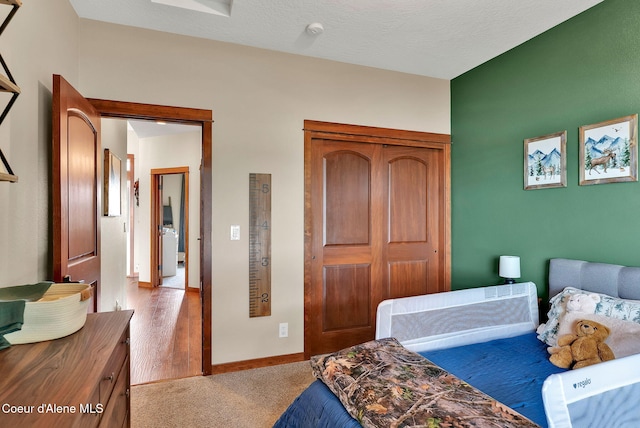 14097 N Pristine Cir, Rathdrum, ID 83858 - bedroom featuring carpet flooring, a closet, and baseboards