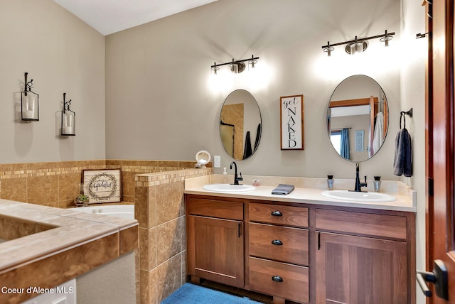 14097 N Pristine Cir, Rathdrum, ID 83858 - bathroom with double vanity, a bath, and tile walls