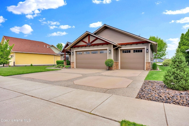 14097 N Pristine Cir, Rathdrum, ID 83858 - craftsman inspired home featuring stone siding, concrete driveway, and a front lawn