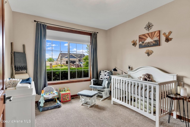 14097 N Pristine Cir, Rathdrum, ID 83858 - carpeted bedroom featuring a nursery area and baseboards