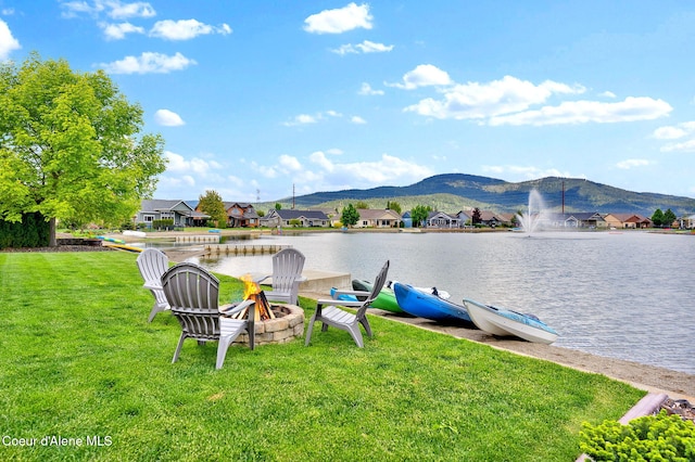 14097 N Pristine Cir, Rathdrum, ID 83858 - dock area featuring a fire pit, a lawn, a residential view, and a water and mountain view