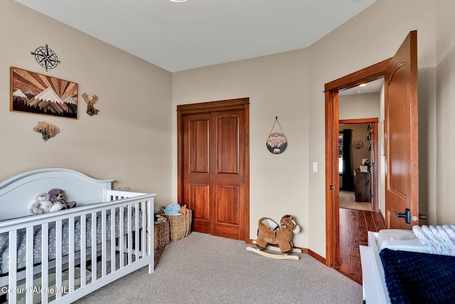 14097 N Pristine Cir, Rathdrum, ID 83858 - bedroom with carpet flooring, a nursery area, and baseboards