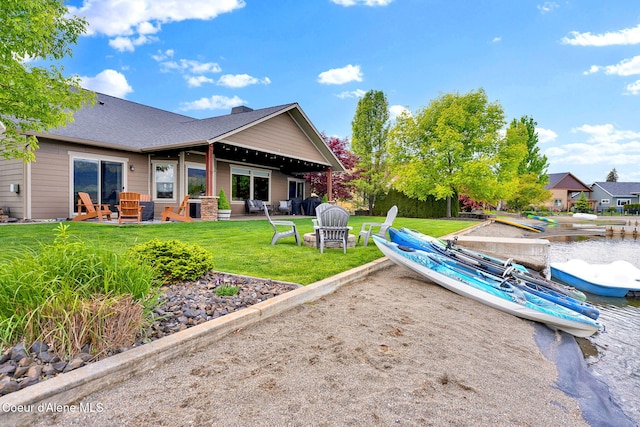 14097 N Pristine Cir, Rathdrum, ID 83858 - back of property with a yard and a patio area