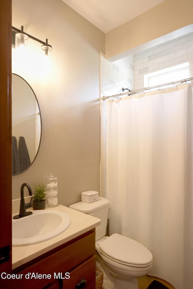 14097 N Pristine Cir, Rathdrum, ID 83858 - full bathroom with vanity, toilet, and curtained shower