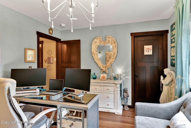 17940 W Sheltered Ct, Hauser, ID 83854 - home office with a chandelier and wood finished floors