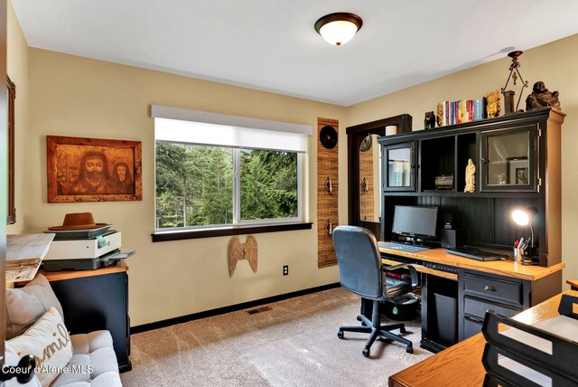 17940 W Sheltered Ct, Hauser, ID 83854 - carpeted home office with baseboards