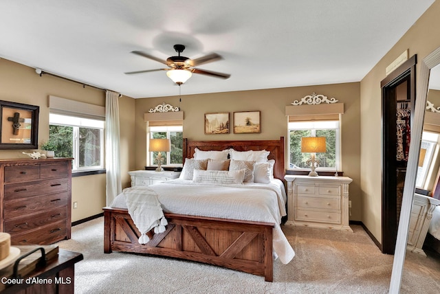 17940 W Sheltered Ct, Hauser, ID 83854 - bedroom featuring light carpet, multiple windows, and baseboards