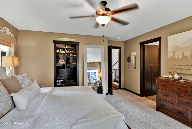 17940 W Sheltered Ct, Hauser, ID 83854 - bedroom featuring light colored carpet, ceiling fan, and baseboards
