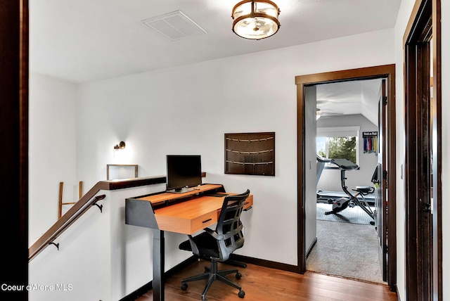 17940 W Sheltered Ct, Hauser, ID 83854 - office featuring hardwood / wood-style floors, lofted ceiling, and baseboards