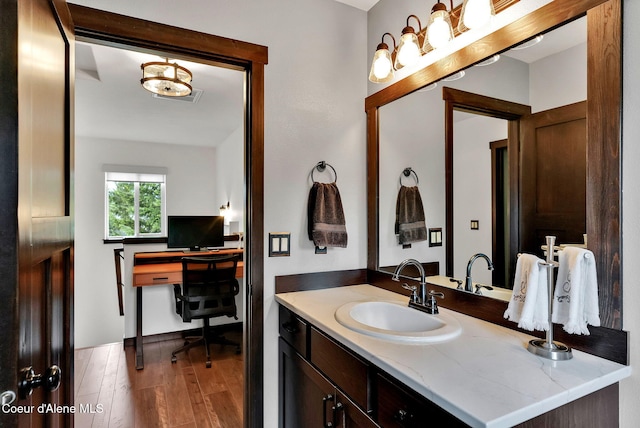 17940 W Sheltered Ct, Hauser, ID 83854 - bathroom with vanity and wood finished floors