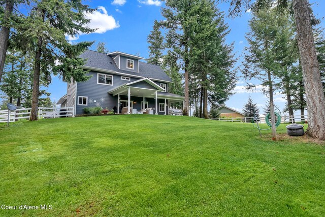 17940 W Sheltered Ct, Hauser, ID 83854 - rear view of house with roof with shingles