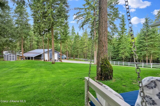 17940 W Sheltered Ct, Hauser, ID 83854 - view of yard featuring a view of trees