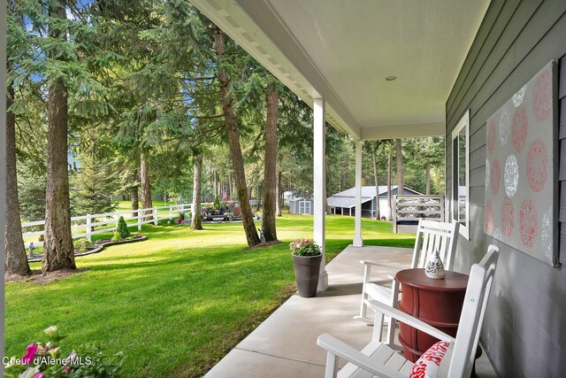 17940 W Sheltered Ct, Hauser, ID 83854 - view of yard featuring a porch
