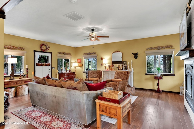 17940 W Sheltered Ct, Hauser, ID 83854 - living room featuring plenty of natural light, a ceiling fan, and hardwood / wood-style floors