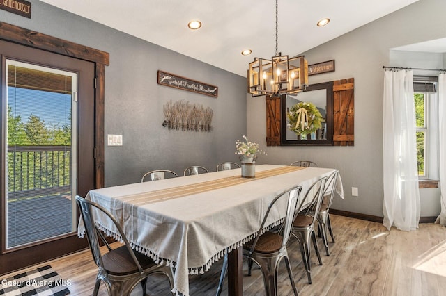 603 Schneiders Rd, Sagle, ID 83860 - dining space featuring light wood finished floors, a chandelier, recessed lighting, baseboards, and lofted ceiling