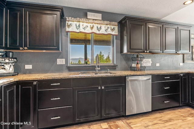 603 Schneiders Rd, Sagle, ID 83860 - kitchen featuring a sink, dishwasher, light stone countertops, and light wood-style floors