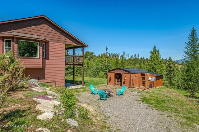 603 Schneiders Rd, Sagle, ID 83860 - view of yard featuring a fire pit and an outdoor structure