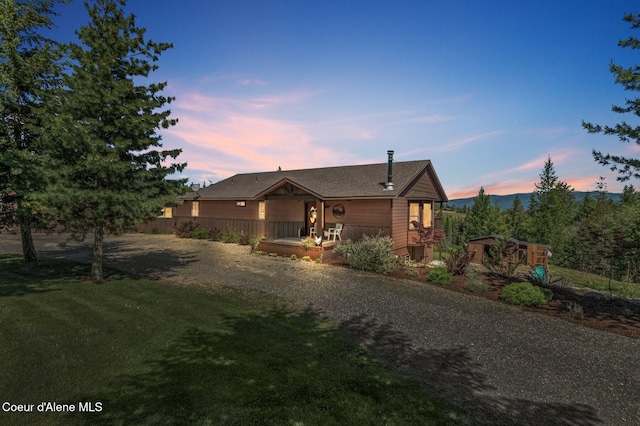 603 Schneiders Rd, Sagle, ID 83860 - view of front of property featuring gravel driveway, a yard, and roof with shingles